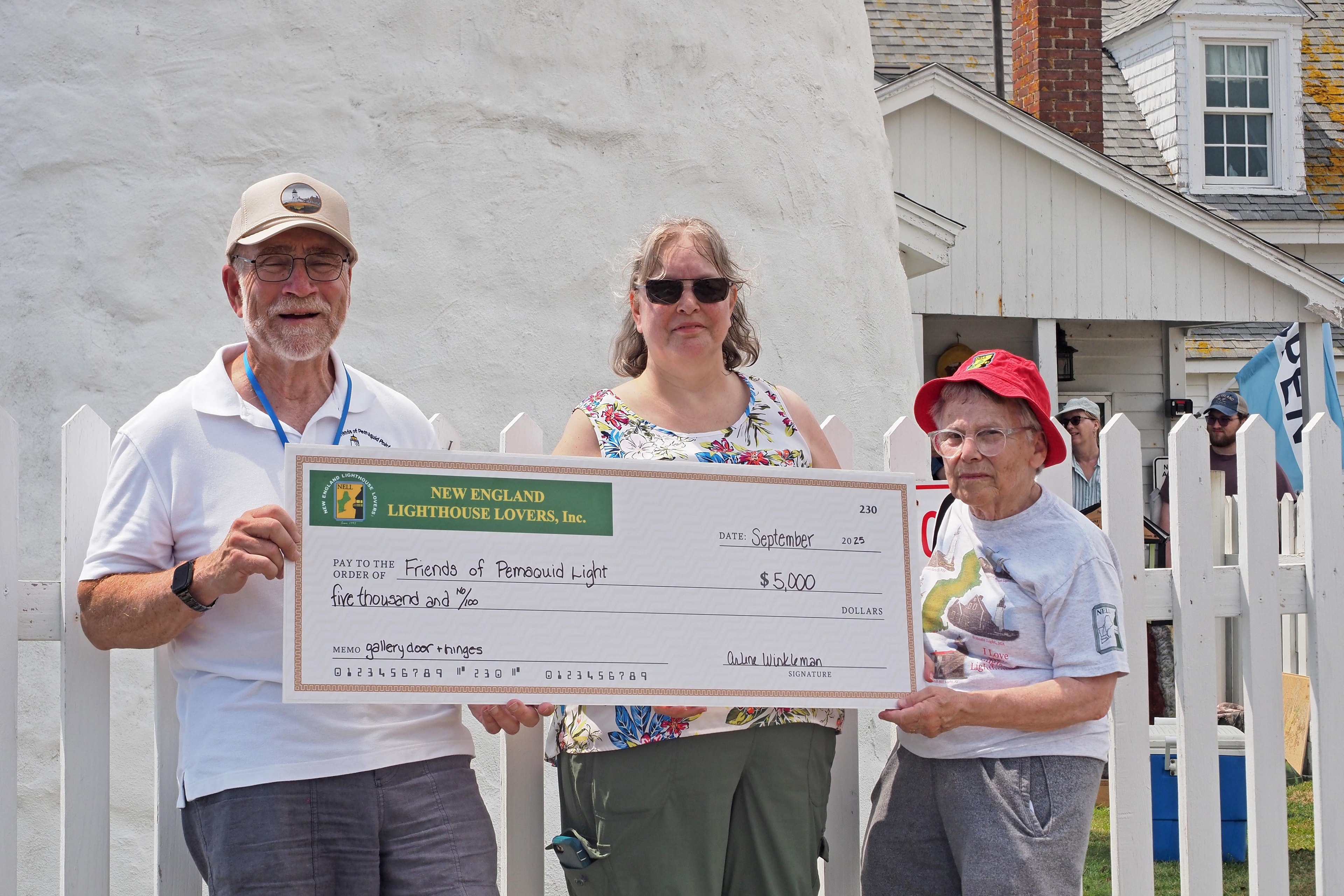 NELL members presenting $5,000 check to Friends of Pemaquid Light